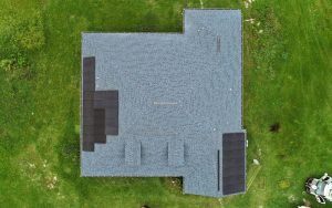 Aerial view of a solar installation on a shingle roof in Dade City, FL
