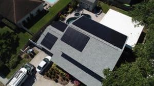 Aerial view of a solar installation on a shingle roof in Dunedin, FL