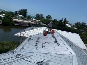 Racks and Inverters installed on a metal roof in Holmes Beach, FL
